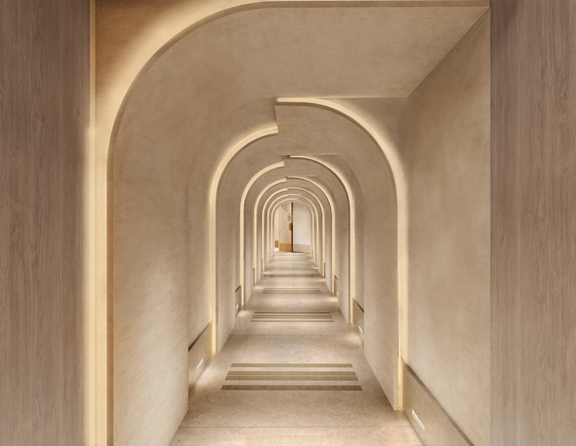 Serene corridor with layered arches and warm cove lighting in a finished, handed-over space