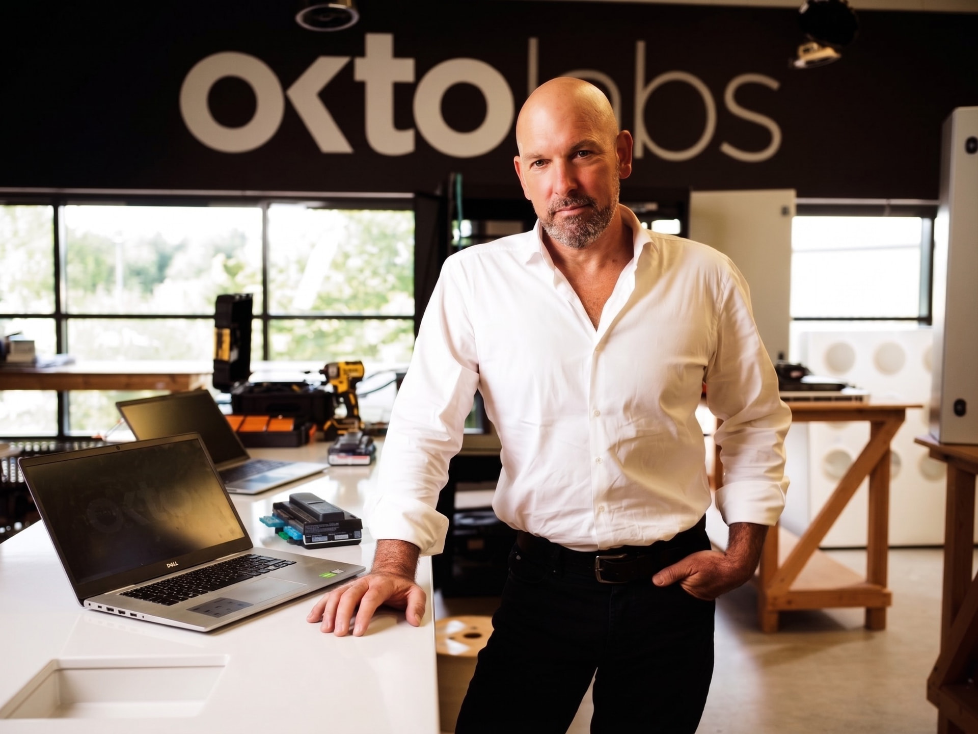 Philip Dowds at OKTOLabs beside integrated technology racks