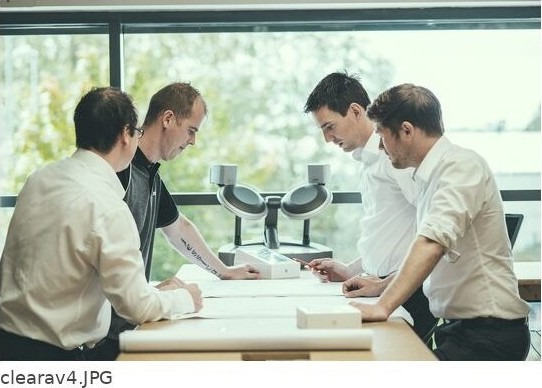 Engineers reviewing drawings at OKTOLabs